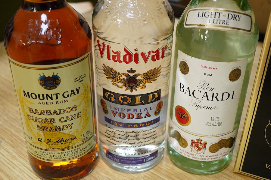 Five bottles of spirits including; Drambuie, Mount Gay Aged Rum, Bacardi, Vladivar Vodka, and Remy Martin Champagne Cognac